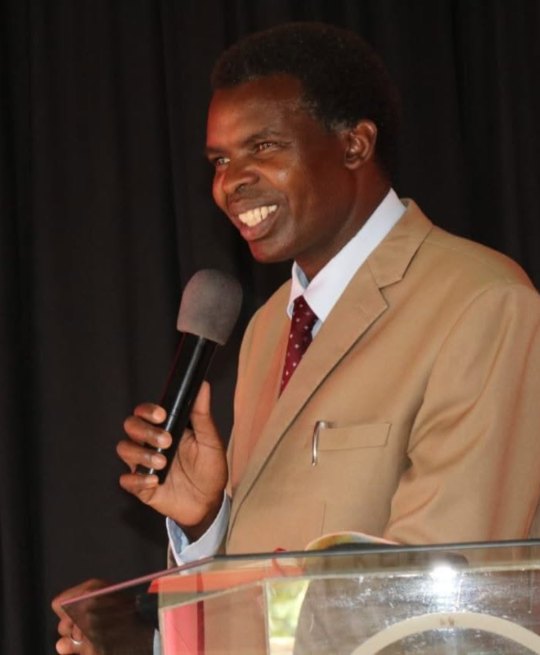 Bishop Peter K. Mwangi preaching at the pulpit